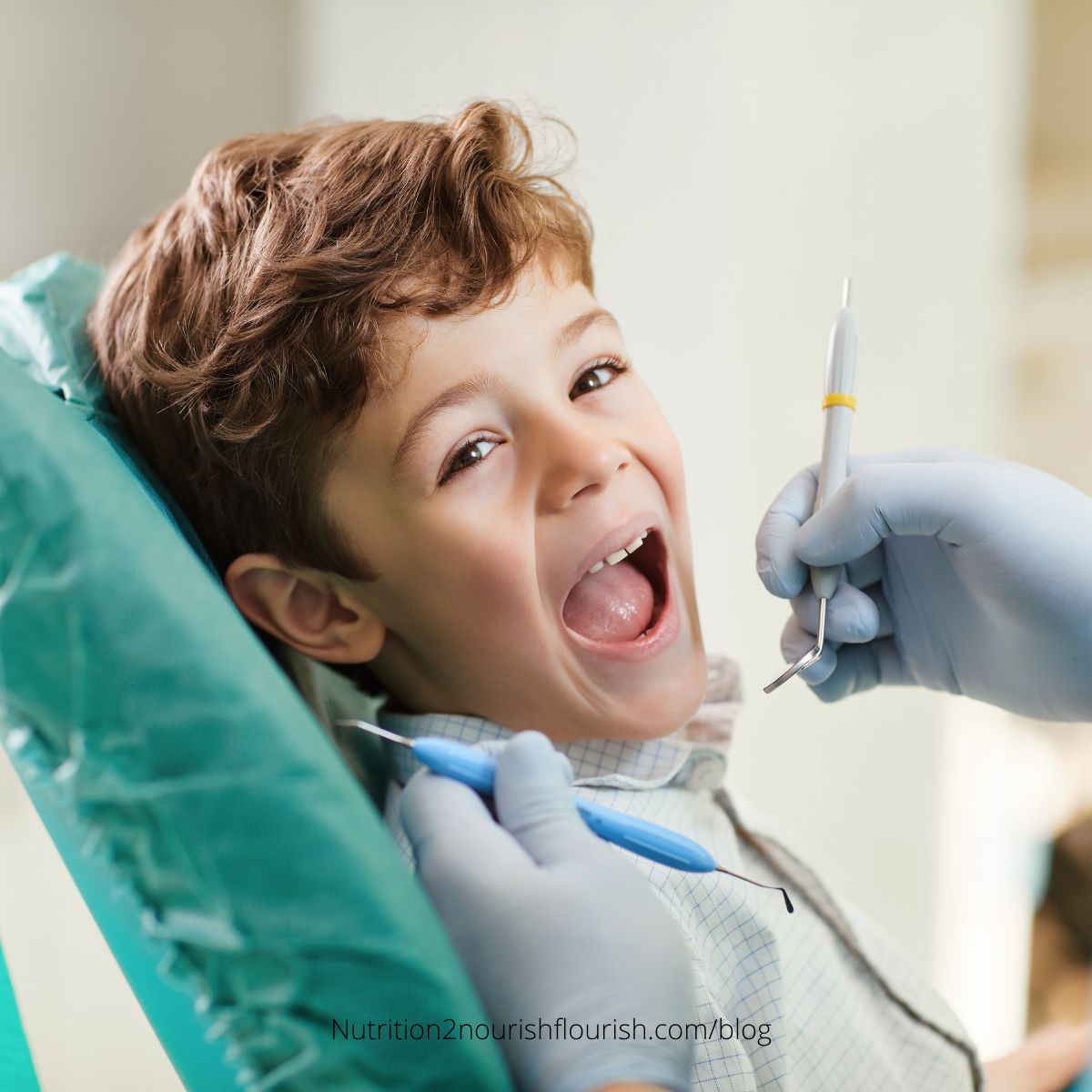 a boy having his teeth looked at the dentist
